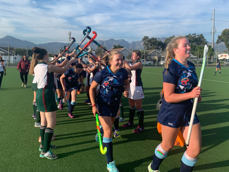 Girls playing hockey